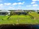 Aerial view of a home showcasing a fenced backyard with pool and canal views at 912 Boundary Blvd, Rotonda West, FL 33947
