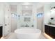 Elegant bathroom with freestanding tub and walk-in shower at 912 Boundary Blvd, Rotonda West, FL 33947