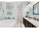 Spa-like bathroom with a freestanding tub, walk-in shower, and double vanity at 912 Boundary Blvd, Rotonda West, FL 33947