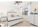 Main bedroom with white platform bed and ceiling fan at 912 Boundary Blvd, Rotonda West, FL 33947