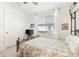 Bedroom with a metal bed frame and window at 912 Boundary Blvd, Rotonda West, FL 33947