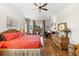 Bedroom with coral bedding and access to outdoor patio at 912 Boundary Blvd, Rotonda West, FL 33947