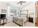 Charming bedroom with a metal bed frame and window at 912 Boundary Blvd, Rotonda West, FL 33947