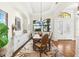 Bright dining room with white cabinets and hardwood floors at 912 Boundary Blvd, Rotonda West, FL 33947