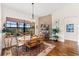 Bright dining room featuring a round table with four chairs and hardwood floors at 912 Boundary Blvd, Rotonda West, FL 33947