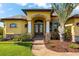 Front entrance of a charming house with a double door at 912 Boundary Blvd, Rotonda West, FL 33947