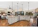 Large kitchen island with granite and stainless steel appliances at 912 Boundary Blvd, Rotonda West, FL 33947