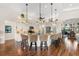 Gourmet kitchen with granite countertops, an island, and wicker barstools at 912 Boundary Blvd, Rotonda West, FL 33947