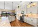Spacious kitchen with granite island, custom cabinetry, and hardwood floors at 912 Boundary Blvd, Rotonda West, FL 33947