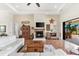 Spacious living room with a fireplace and sliding doors at 912 Boundary Blvd, Rotonda West, FL 33947