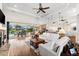 Open living space showcasing a white sectional sofa, fireplace, and pool view at 912 Boundary Blvd, Rotonda West, FL 33947
