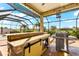 Outdoor kitchen with grill and bar at 912 Boundary Blvd, Rotonda West, FL 33947