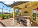 Outdoor kitchen with bar seating at 912 Boundary Blvd, Rotonda West, FL 33947