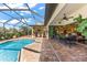 Spacious pool and patio with kitchen access at 912 Boundary Blvd, Rotonda West, FL 33947