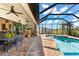 Inviting pool area with spa and covered patio at 912 Boundary Blvd, Rotonda West, FL 33947