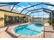 Relaxing pool and spa with covered patio at 912 Boundary Blvd, Rotonda West, FL 33947