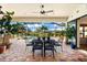 Enjoy this backyard oasis with a covered patio, pool, and spa at 912 Boundary Blvd, Rotonda West, FL 33947
