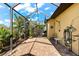 Screened patio with brick flooring at 912 Boundary Blvd, Rotonda West, FL 33947