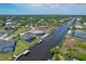 Stunning aerial view of canal-front home and community at 9222 Melody Cir, Port Charlotte, FL 33981