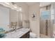 Clean bathroom with granite vanity, shower, and decorative tile at 9222 Melody Cir, Port Charlotte, FL 33981