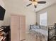 Cozy bedroom with a daybed, built-in wardrobe, and window coverings at 9222 Melody Cir, Port Charlotte, FL 33981