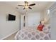 Guest bedroom with a king-size bed and TV at 9222 Melody Cir, Port Charlotte, FL 33981