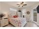 Guest bedroom with queen-size bed and access to the patio at 9222 Melody Cir, Port Charlotte, FL 33981