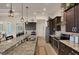 Modern kitchen with granite countertops, stainless steel appliances, and ample cabinetry at 9222 Melody Cir, Port Charlotte, FL 33981