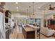 Open kitchen boasts granite counters, stainless steel appliances, and island with seating at 9222 Melody Cir, Port Charlotte, FL 33981