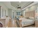 Spacious main bedroom with king-size bed, dresser, and access to a patio at 9222 Melody Cir, Port Charlotte, FL 33981