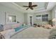 Main bedroom with king bed, dresser, and access to a private patio at 9222 Melody Cir, Port Charlotte, FL 33981