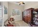 Home office with built-in shelving and a comfortable sitting area at 9222 Melody Cir, Port Charlotte, FL 33981