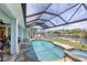 Screened pool and spa with canal views at 9222 Melody Cir, Port Charlotte, FL 33981