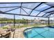 Relaxing pool area with screened enclosure, overlooking canal at 9222 Melody Cir, Port Charlotte, FL 33981