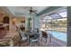 Covered patio with dining area and pool access at 9222 Melody Cir, Port Charlotte, FL 33981
