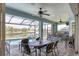 Covered patio with pool, spa, and outdoor kitchen at 9222 Melody Cir, Port Charlotte, FL 33981