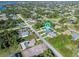 An aerial view showcasing a home's location within a residential community at 126 Spur Dr, Rotonda West, FL 33947