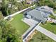 Aerial view showcasing home's backyard and neighborhood at 126 Spur Dr, Rotonda West, FL 33947