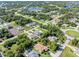 Bird's-eye view of a neighborhood featuring various houses and landscaping at 126 Spur Dr, Rotonda West, FL 33947