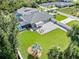 Aerial view showing house, pool, and expansive backyard at 126 Spur Dr, Rotonda West, FL 33947