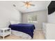 Cozy bedroom with a queen bed and ceiling fan at 126 Spur Dr, Rotonda West, FL 33947