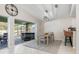 Bright dining room with sliding doors to the pool area at 126 Spur Dr, Rotonda West, FL 33947