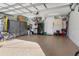 Spacious garage with storage cabinets and epoxy floor at 126 Spur Dr, Rotonda West, FL 33947