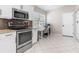 Kitchen features a built-in workspace and white cabinetry at 126 Spur Dr, Rotonda West, FL 33947