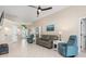 Open concept living room with a view of the entryway and pool at 126 Spur Dr, Rotonda West, FL 33947