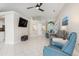 Living room with a view into kitchen, entryway and pool area at 126 Spur Dr, Rotonda West, FL 33947