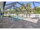 Inviting screened pool with a spacious deck at 126 Spur Dr, Rotonda West, FL 33947