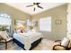 Comfortable bedroom featuring a queen-size bed and two armchairs at 150 Mandalay Rd, Punta Gorda, FL 33950