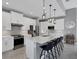 Modern kitchen with white cabinets, stainless steel appliances, and island at 15448 Melport Cir, Port Charlotte, FL 33981