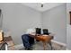 Home office with wood desk and comfortable chair at 15448 Melport Cir, Port Charlotte, FL 33981